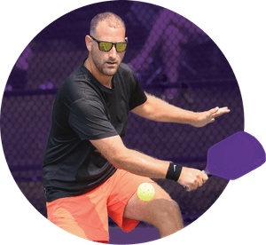 Ryan McLaughlin returning a shot on the pickleball court
